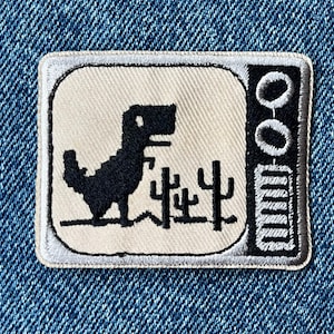 Retro Dinosaur Iron-On Patch – Offline Pixel Dino Badge – Funny Gamer Jacket Applique