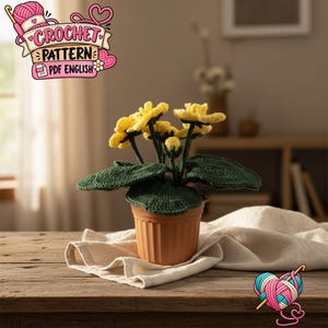 Peut inclure: Un modèle de crochet PDF en anglais représentant une plante en pot avec des fleurs jaune vif et des feuilles vert foncé. La plante est placée dans un pot en plastique côtelé de couleur terre cuite, mettant en valeur le travail du fil.