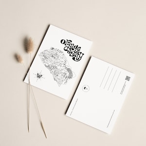 May include: Black and white postcard featuring a detailed illustration of Orange County, California. The postcard includes the text "Orange County" in a stylized font. The back of the postcard is blank for writing.