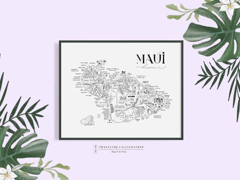 May include: A black and white line art map of Maui, Hawaii, with the name "Maui, Hawaii" written in cursive at the top. The map is surrounded by a black frame and the text "Traveling Calligrapher" is at the bottom.