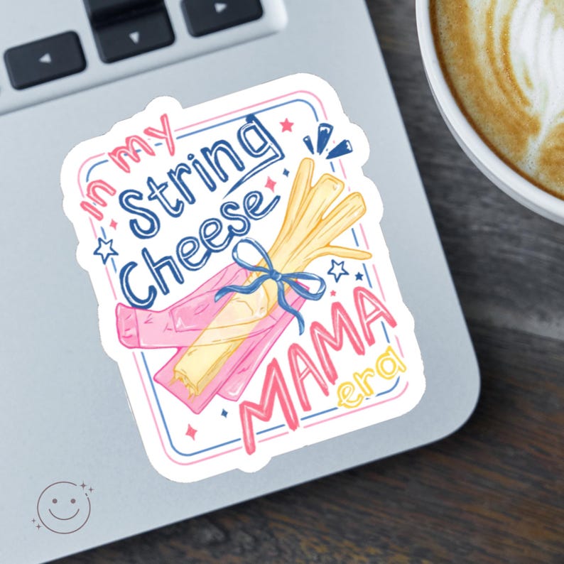 May include: A sticker with the text "In my String Cheese Mama Era" in blue and pink. The sticker features a bundle of string cheese tied with a blue ribbon, and a pink wrapper. The sticker is on a laptop.