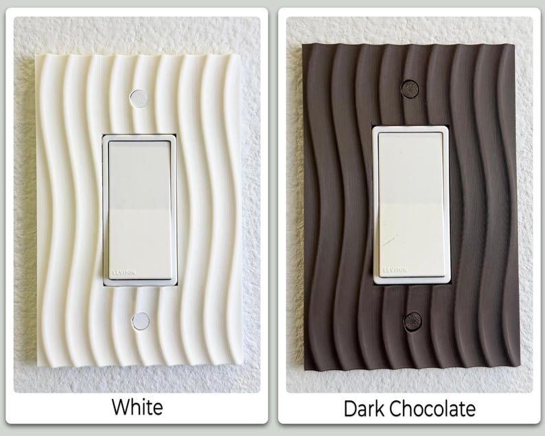 May include: Two light switch covers, one white and one dark chocolate, with a wavy, textured design. Each cover has a white switch and two small circular screw holes. The text "White" and "Dark Chocolate" are below the respective covers.
