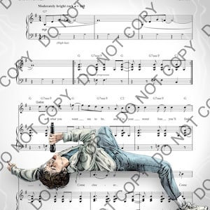 Puede incluir: Partitura de la canción "I'M ALIVE" con letra de Brian Yorkey y música de Tom Kitt. La imagen muestra un dibujo de una persona acostada sobre la partitura, sosteniendo un micrófono.