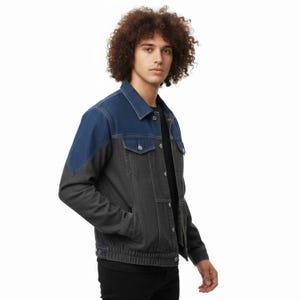May include: A two-tone denim jacket in blue and gray. The jacket features a classic collar, button-up front, and pockets. The sleeves and lower body are gray, while the shoulders and collar are blue. The jacket is a casual outerwear piece.