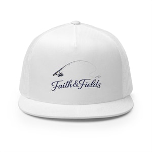 May include: White trucker hat with a mesh back and a curved brim. The hat features a navy blue graphic of a fishing rod and the words "Faith & Fields" in a script font. A stylish accessory for fishing enthusiasts.