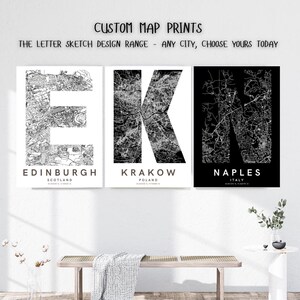 May include: Three framed map prints with the letters E, K, and N, representing Edinburgh, Krakow, and Naples. The maps are monochrome, with city names below. The text "CUSTOM MAP PRINTS" is at the top, with "THE LETTER SKETCH DESIGN RANGE - ANY CITY, CHOOSE YOURS TODAY".