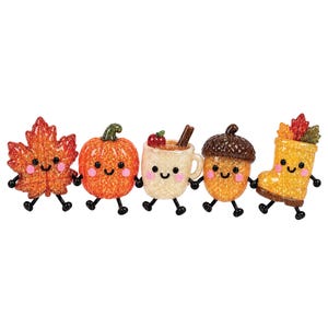 May include: A set of five glittery, anthropomorphic autumn-themed figurines holding hands. The characters include an orange maple leaf, a round orange pumpkin, a beige mug with a cinnamon stick, a brown acorn, and a yellow rain boot with leaves.