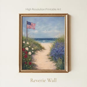 May include: Framed print of a beach scene with an American flag waving in the wind. A sandy path leads to the ocean, flanked by roses and purple flowers. The words "High Resolution Printable Art" and "Reverie Wall" are visible.