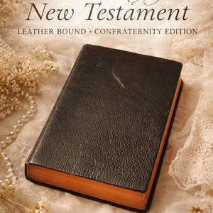 May include: A vintage 1941 Catholic New Testament, leather-bound, Confraternity Edition. The book has a dark brown cover with a textured appearance and orange-toned edges. The background features lace and floral accents.