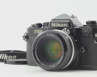 Cámara y objetivo Nikon FE2 Black Ai 50mm F/1.8 de 35 mm para película, procedente de Japón.