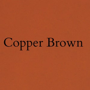 May include: A solid copper brown background with the words "Copper Brown" in a black serif font. The text is centered and the background is a warm, earthy tone.