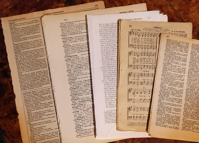 May include: A collection of vintage paper pages with text and music. The pages are yellowed with age and have a worn, antique look. The text includes a dictionary definition of the word "prejudice" and a hymn titled "Others".