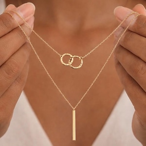 May include: A rustic wooden sign with the text "Welcome to our home" in white lettering. The sign features a distressed finish and a simple, inviting design, perfect for entryway decor.