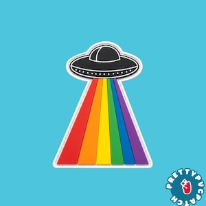 May include: A black UFO patch with a white border, emitting a wide, triangular rainbow-colored beam of light. The beam consists of vertical stripes in red, orange, yellow, green, blue, and purple. The text Pretty Patch is in the corner.