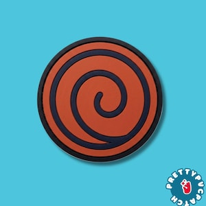 May include: A circular patch featuring a dark navy blue spiral design set against a burnt orange background. The patch has a thick, dark navy blue border. In the bottom right corner, there is a small logo with the text PRETTYPATCH.