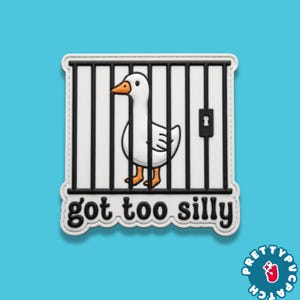 May include: A white and orange cartoon goose inside a black and white cage, with the text "got too silly" in black. The image is on a white background with a blue background.