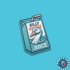 May include: A light blue patch shaped like a juice box with the words "SILLY GOOSE JUICE" and a cartoon goose illustration. The patch has a straw and is set against a light blue background.