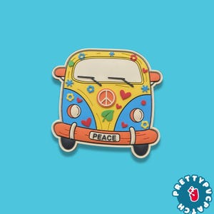 May include: A colorful, cartoon-style bus with a peace symbol and the word "PEACE" on the bumper. The bus is yellow, blue, and orange, with flower and heart details. The background is a solid light blue.