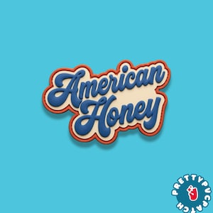 May include: A patch with the words "American Honey" in blue script lettering, outlined in white and red, on a cream background. The patch is set against a bright blue backdrop. A logo for PrettyPucPatch is in the bottom right corner.