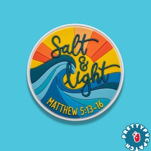 May include: A round patch with a white border features the words "Salt & Light" in yellow script over a blue wave and a yellow and orange sun. The text "Matthew 5:13-16" is below the wave.