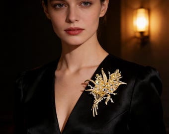 Broche artesanal con forma de espiga de trigo: cristal de citrino, acabado en oro mate, símbolo de abundancia.