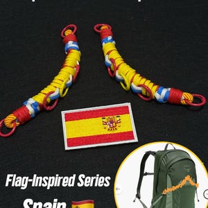 May include: Two backpack extension straps woven from red, yellow, and blue paracord with red metal rings, accompanied by a rectangular embroidered patch of the Spanish flag and an inset showing the straps attached to a green backpack.