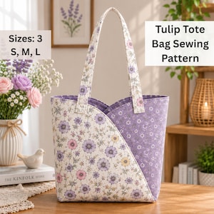 May include: A Tulip Tote Bag Sewing Pattern with text reading Sizes: 3 S, M, L and Tulip Tote Bag Sewing Pattern. The tote bag features a cream fabric with a purple, pink, and yellow floral print and a solid purple fabric with a small white floral print.