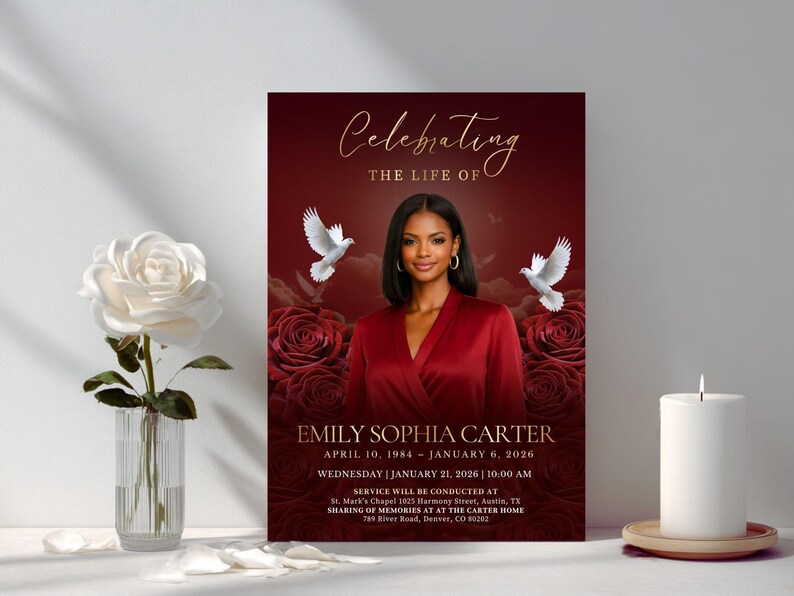 May include: A funeral program featuring a portrait of a woman in a red top, surrounded by red roses and white doves. The text reads Celebrating the life of Emily Sophia Carter, April 10, 1984 &ndash; January 6, 2026, and service details in gold.