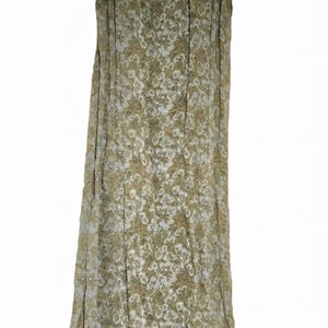May include: A sleeveless, floor-length dress in shades of olive green and beige, adorned with a delicate floral pattern. The dress features a scoop neckline and a flowing silhouette, suitable for casual or semi-formal occasions.