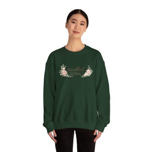 Sudadera de cuello redondo Tawakkul "Confía en lo que se va desarrollando"