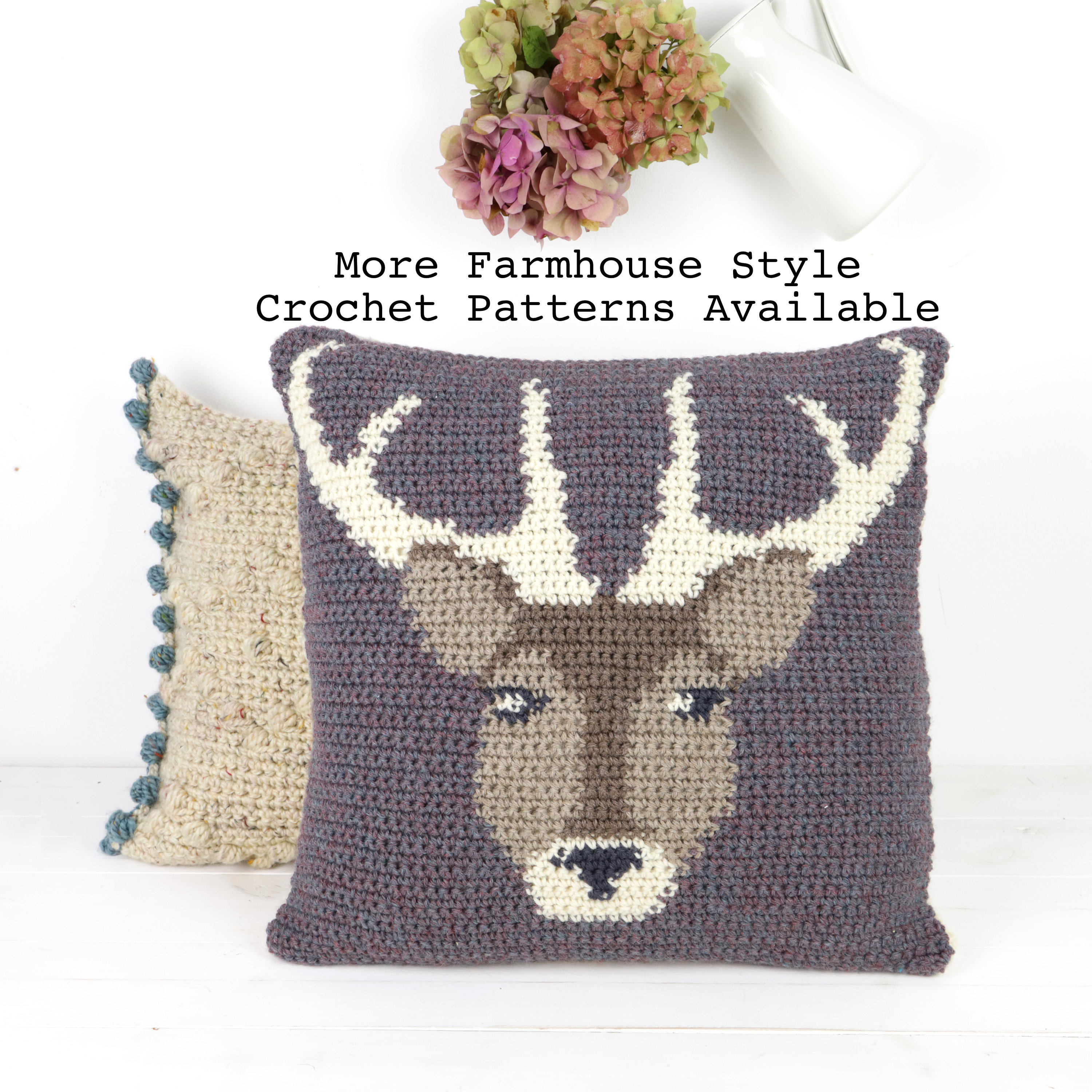 May include: Two crocheted throw pillows, one with a brown deer face and antlers on a purple background, and the other with a beige and brown pattern. The text "More Farmhouse Style Crochet Patterns Available" is above the pillows.