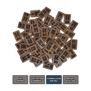May include: A collection of rectangular wooden tiles, each featuring a unique black engraved I Ching hexagram symbol and a corresponding number. The tiles are arranged in a scattered pile, showcasing natural wood grain textures and dark markings.