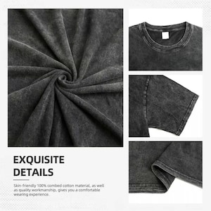 May include: A charcoal gray t-shirt with a mineral wash finish, featuring a crew neckline, short sleeves, and a hemmed bottom edge. The fabric displays a textured, mottled appearance across the garment, including the collar and sleeve details.
