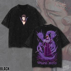 May include: A white ceramic mug with a black handle and the text "But First, Coffee" in a bold, black font. The mug is set against a blurred background, suggesting a cosy setting.