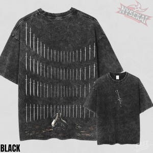 May include: Black oversized t-shirts with a distressed finish. The back of the shirt features a white graphic of swords in rows, with a figure at the bottom. A smaller shirt shows a single sword graphic. The word "BLACK" is at the bottom.