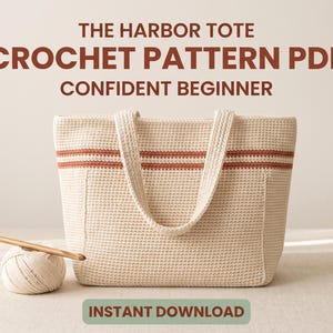 May include: A cream-colored crochet tote bag with a horizontal rust-colored stripe, accompanied by a ball of yarn and a wooden crochet hook. The text reads: THE HARBOR TOTE CROCHET PATTERN PDF CONFIDENT BEGINNER INSTANT DOWNLOAD.