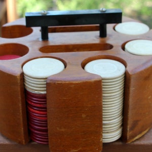 Vintage poker chips in wooden holder