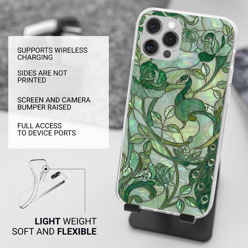 May include: A phone case with a green peacock and floral design. The case has a clear border and the text "SUPPORTS WIRELESS CHARGING", "SIDES ARE NOT PRINTED", "SCREEN AND CAMERA BUMPER RAISED", "FULL ACCESS TO DEVICE PORTS", "LIGHT WEIGHT SOFT AND FLEXIBLE".