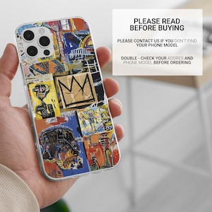 May include: A clear phone case featuring a colorful collage of abstract art in shades of blue, orange, yellow, and black. The case has a multi-camera cutout. Text on the case reads "PLEASE READ BEFORE BUYING".