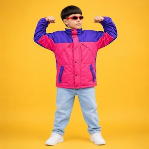 May include: A color-blocked jacket featuring a vibrant purple upper section and a bright pink lower section, paired with light blue denim jeans and red-framed sunglasses. The jacket includes a high collar, long sleeves, and a front button closure.