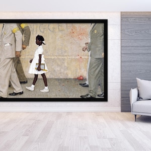 May include: A framed print of Norman Rockwell's painting, "The Problem We All Live With." It depicts a young Black girl in a white dress, escorted by U.S. Marshals, walking past a wall with a racial slur.