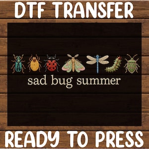 May include: A DTF transfer sheet featuring a row of seven colorful insect illustrations including a beetle, ladybug, moth, dragonfly, caterpillar, and stink bug, with the text "sad bug summer" printed below them and "READY TO PRESS" at the bottom.