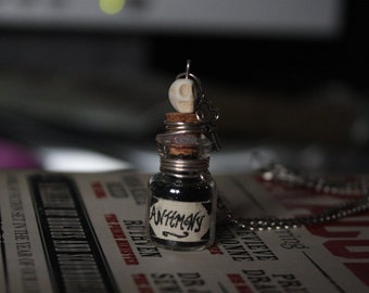Antimony necklace, Tiny alchemical skull bottle.