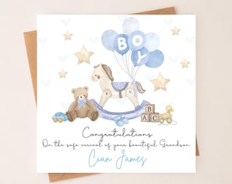 May include: A baby shower greeting card with a watercolor illustration. The card features a rocking horse, teddy bear, and balloons that spell "BOY". The text reads "Congratulations" and "Cian James".