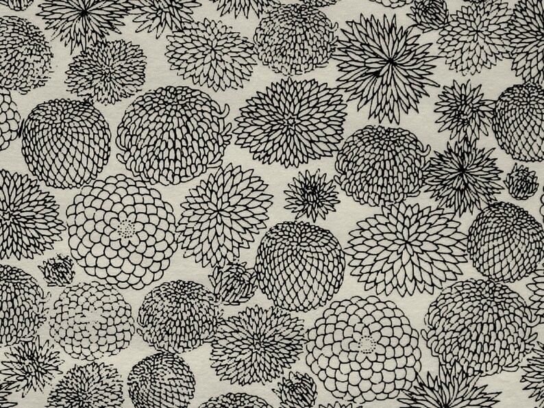 May include: A seamless pattern of black and white stylized floral designs on a beige background. The flowers are drawn in a simple, graphic style and are arranged in a repeating pattern.