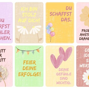 May include: A set of eight colorful cards with inspirational messages and illustrations. The cards feature text like "You can make mistakes" and "Celebrate your successes," along with images of flowers, balloons, and a child with a backpack.