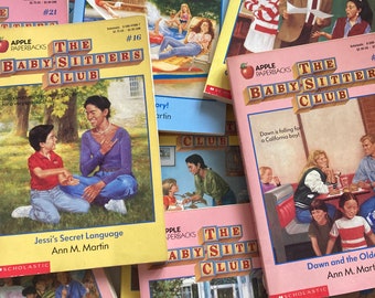 May include: A collection of vintage "The Baby-Sitters Club" paperback books. The covers feature colorful illustrations of children and adults, with titles like "Jessi's Secret Language" and "Dawn and the Older Crowd". The books are from the Apple Paperbacks series.