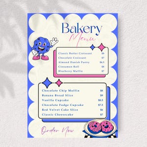 May include: A bakery menu with a blue and white floral design. The menu features a cartoon blueberry character and a list of baked goods, including croissants, muffins, and cupcakes. The text "Bakery Menu" is at the top.