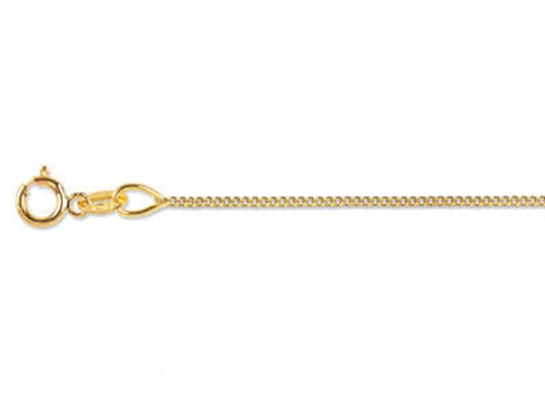 May include: A gold chain necklace with a lobster clasp.