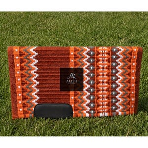 May include: A rectangular horse saddle pad with a woven design in shades of orange, white, and gray. The pad features a black leather-like bottom and the text "ALISH REIGN" on a dark square.